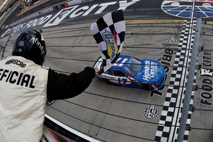 Photo of Kyle Larson, driving the No. 17 NASCAR Chevy, crossing the finish line during the Xfinity Series race at Bristol in first. He'd go on to win the Cup Series race the next day. 