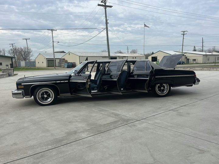 1976 Buick LeSabre limo driver side profile with the doors open.