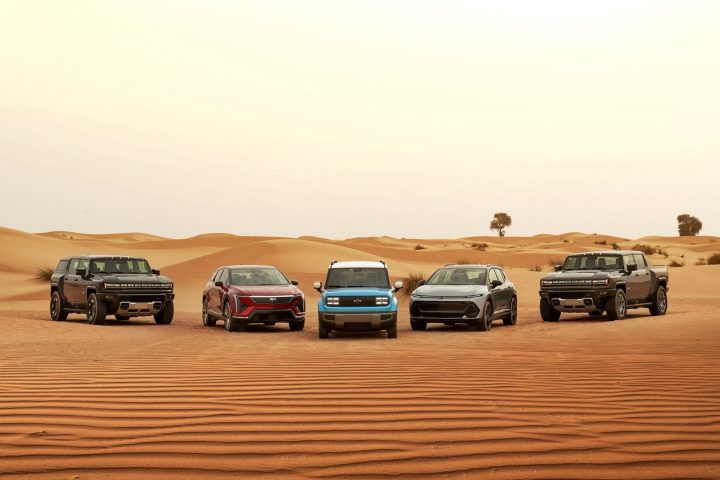 Desert shot with GM electric vehicles. From left to right: GMC Hummer EV SUV, Cadillac Optiq, Chevy Spark EUV, Chevy Equinox EV and GMC Hummer EV Pickup.