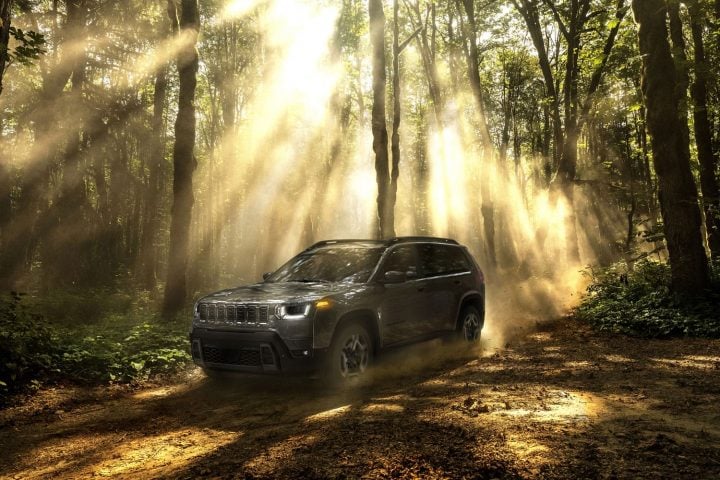2026 Jeep Cherokee parked in a forest.