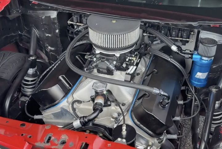 Big Block V8 in a Chevy Spark hatchback.