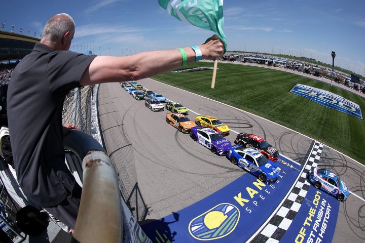 Photo showing the Cup Series field taking the green flag at Kansas, headed by Kyle Larson's No. 5 NASCAR Chevy. He went on to win in dominating fashion.