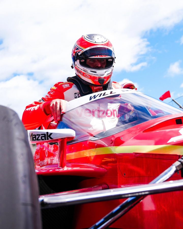 Photo of Will Power getting into his Chevy IndyCar for Indy 500 qualifying. Power and Josef Newgarden were both penalized for illegally modified parts and will start at the rear. 