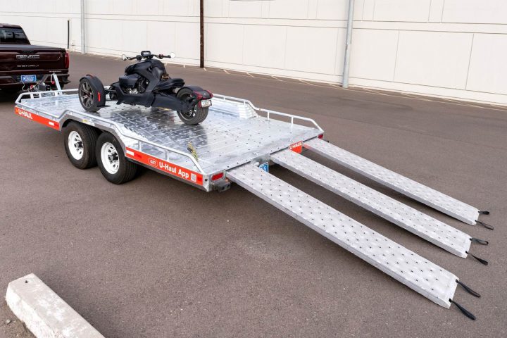 The U-Haul Toy Hauler with a three-wheeler, showing its 8-foot ramps. 