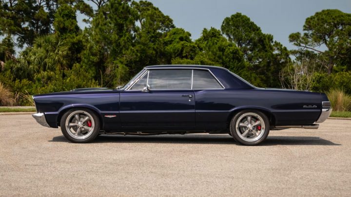 Side profile of the 1965 Pontiac GTO Coupe heading to auction in Florida.