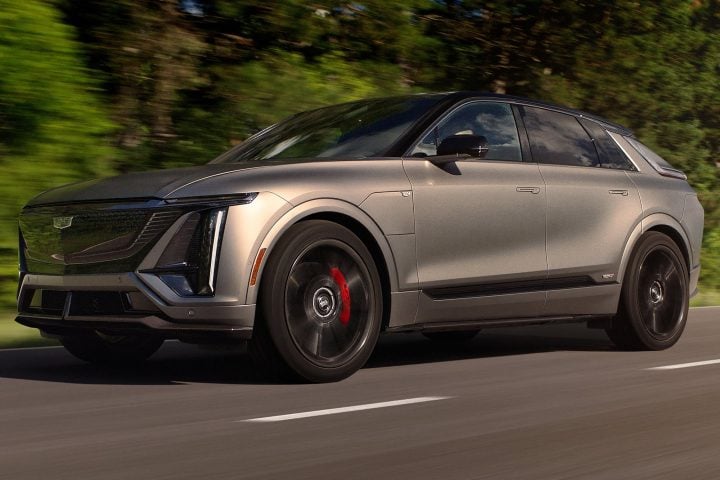 Front three-quarter view of the 2026 Cadillac Lyriq-V driving on a road.