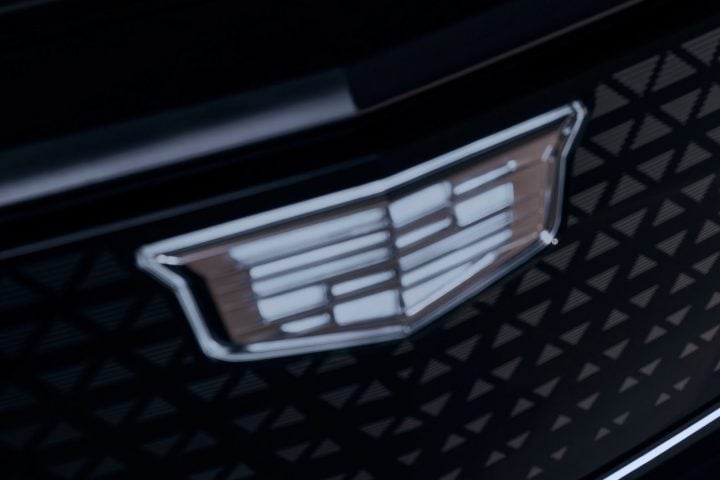 View of the illuminated Cadillac logo on the grille of the all-new Lyriq-V.