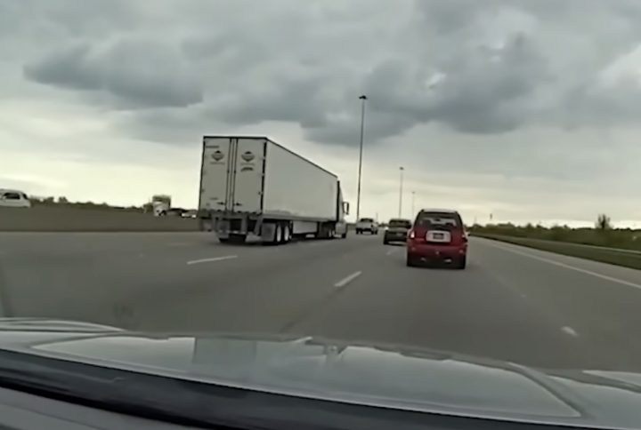 A driver in a GMC Envoy runs from police.
