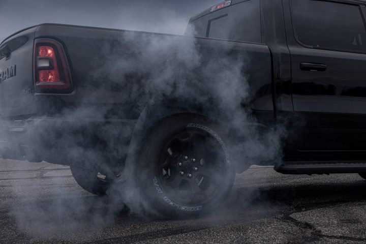 2026 Ram 1500 Black Express doing a burnout.