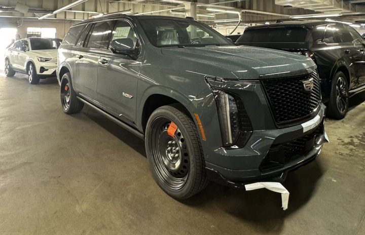 A Cadillac Escalade-V rolling on temporary steel wheels.