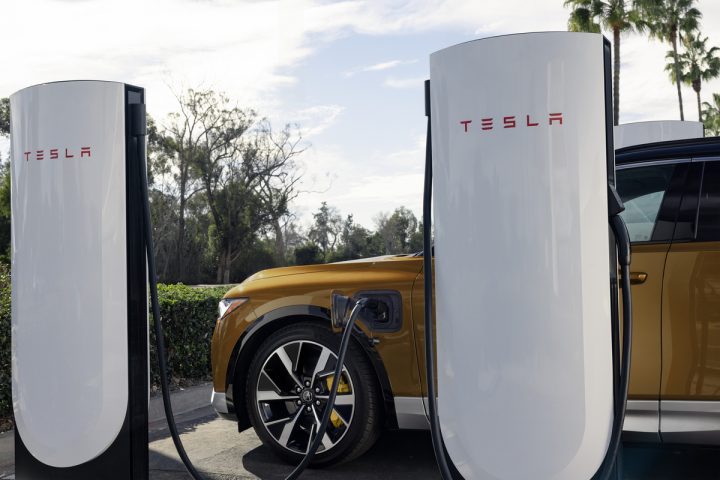 Acura ZDX charging at a Tesla Supercharger station.
