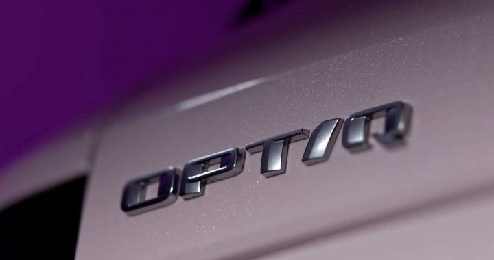 Badging on a pink Cadillac Optiq crossover.