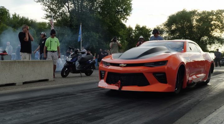 Chevy Camaro dragster getting ready to stage at the dragstrip.