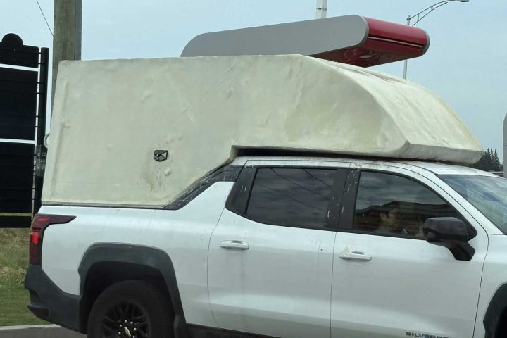 Chevy Silverado EV WT with custom bed topper.