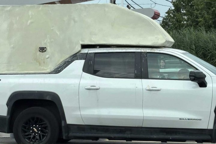 Chevy Silverado EV WT with custom bed topper.