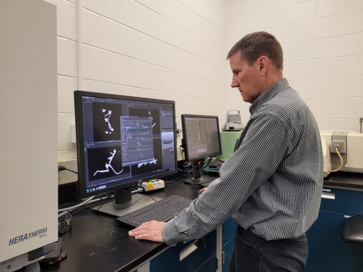 GM engineer performing a CT scan.