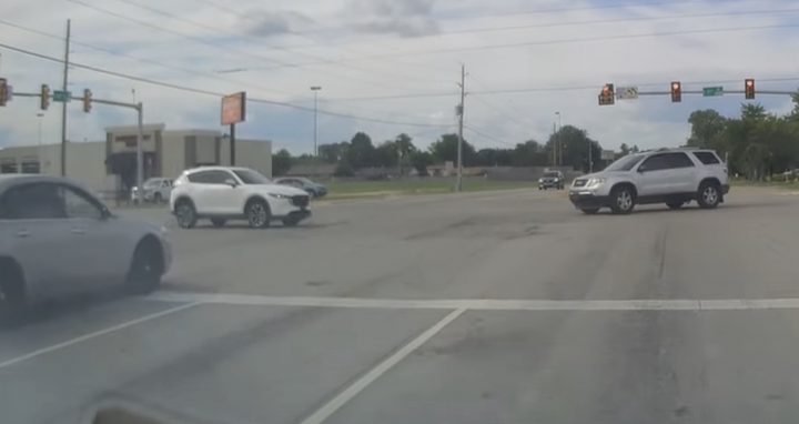 Moments before a GMC Acadia and Mazda CX-5 collide.